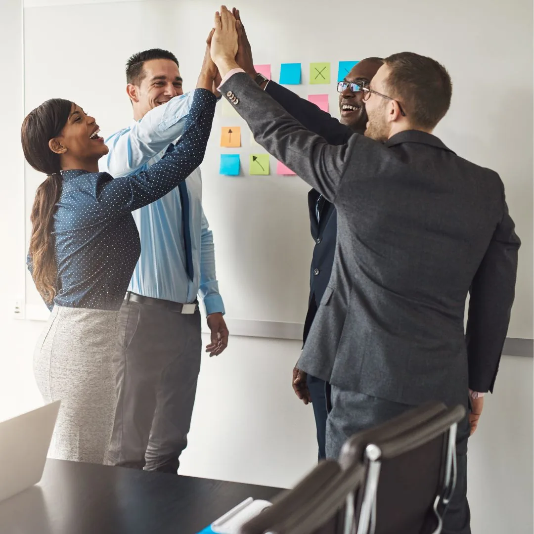 A professional in a suit gesturing toward a contract or legal document during a meeting.
