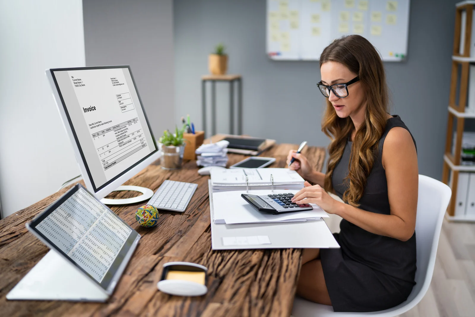 Preparing business tax paperwork at a desk