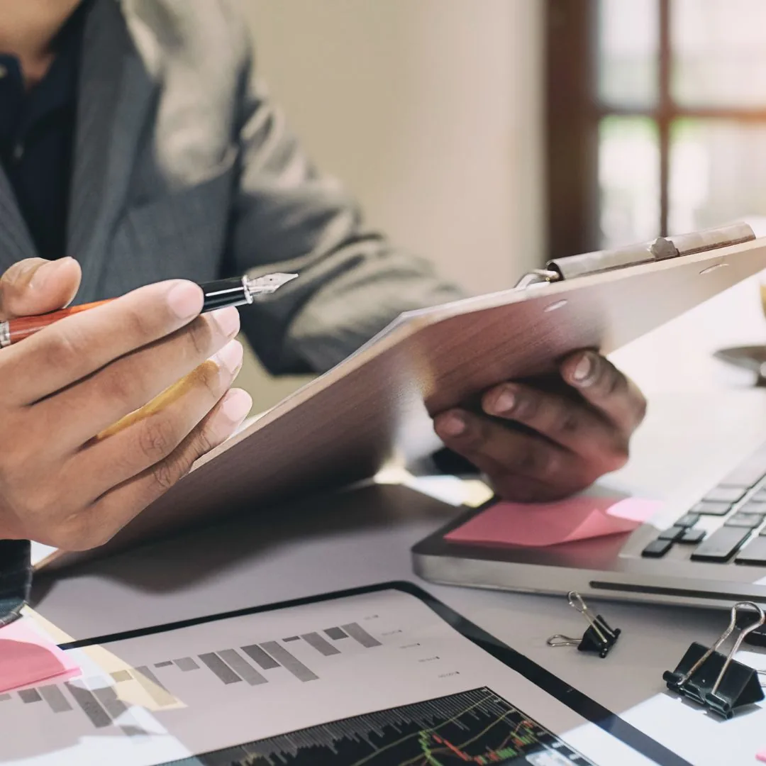 Reviewing financial documents at a desk