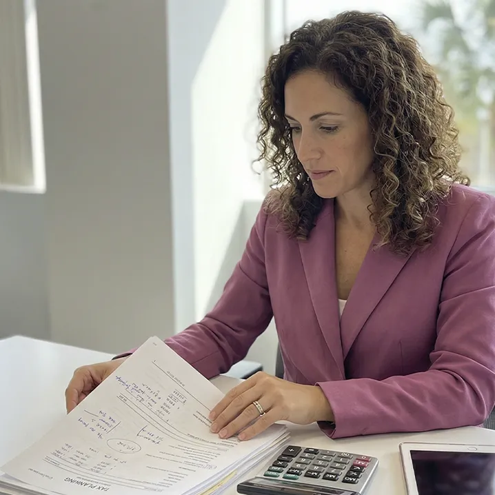 Business owner reviewing structured business tax planning documents.